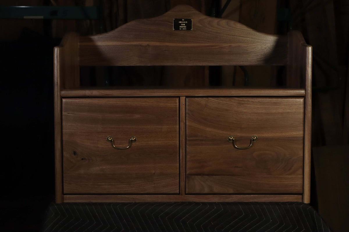 Solid walnut toy chest with elegant design, featuring two drawers for storage, perfect as a piece of heirloom furniture.
