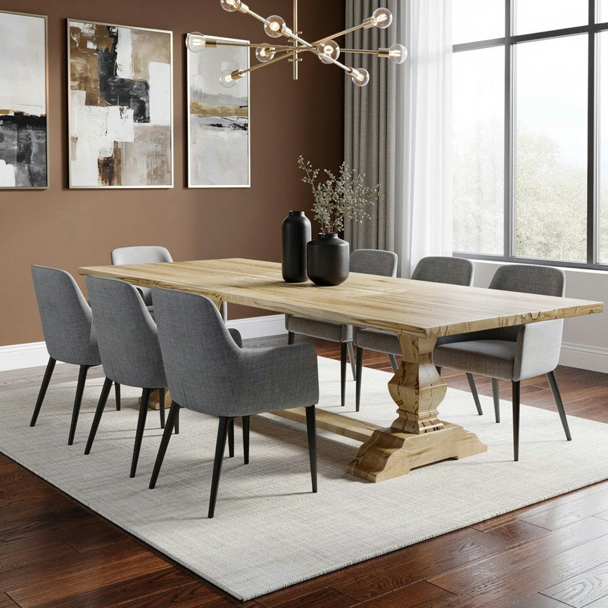 Modern dining room with wooden table and gray chairs, featuring a chandelier and wall art.
