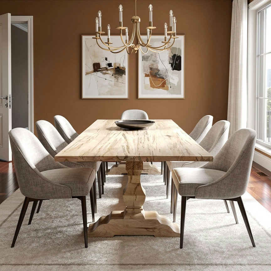 Dining room with wooden table and chairs, chandelier, and framed pictures on the wall.